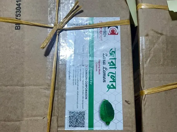 A Zara Lemon carton with the Crimson Corporation shipping label and QR code